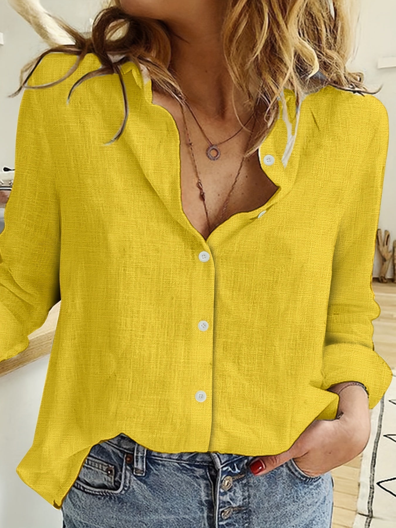 Elowen - Blusa a maniche lunghe con revers e frange